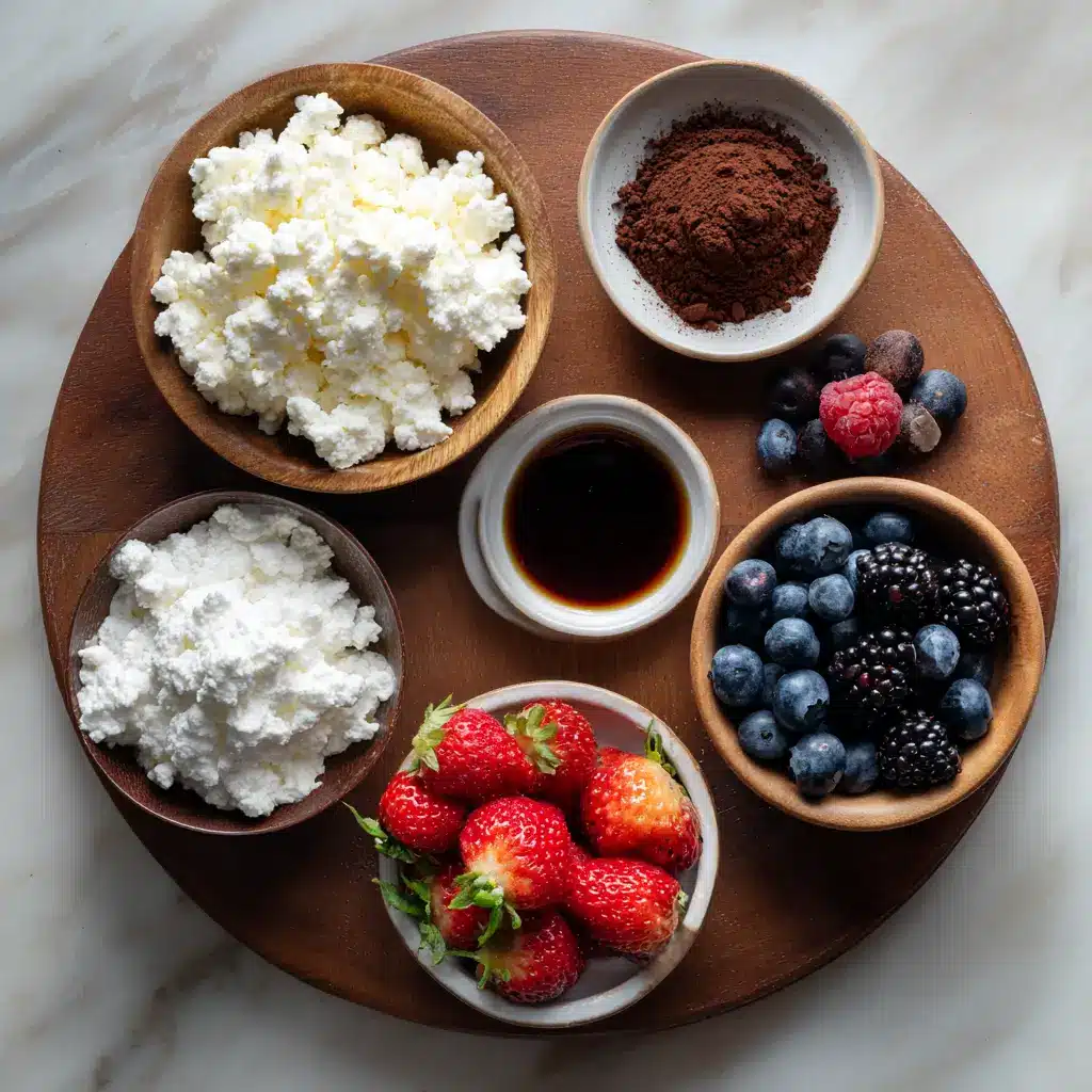 ingredients for low carb cottage cheese dessert with berries and cocoa